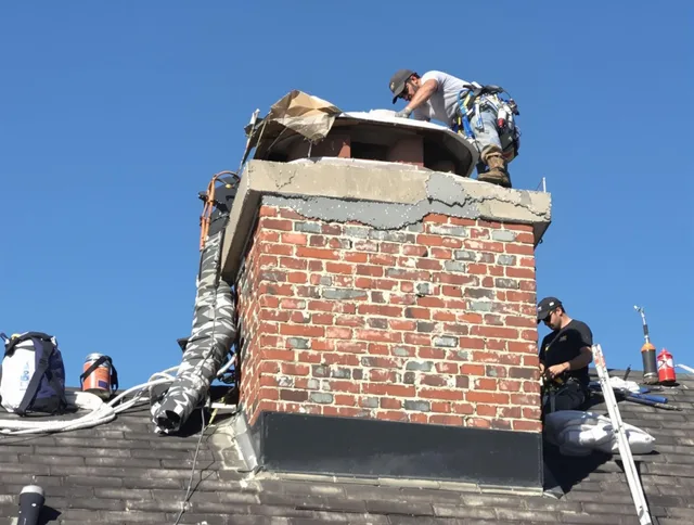 Garden Grove Chimney Sweep installing a custom chimney crown in Garden Grove, CA