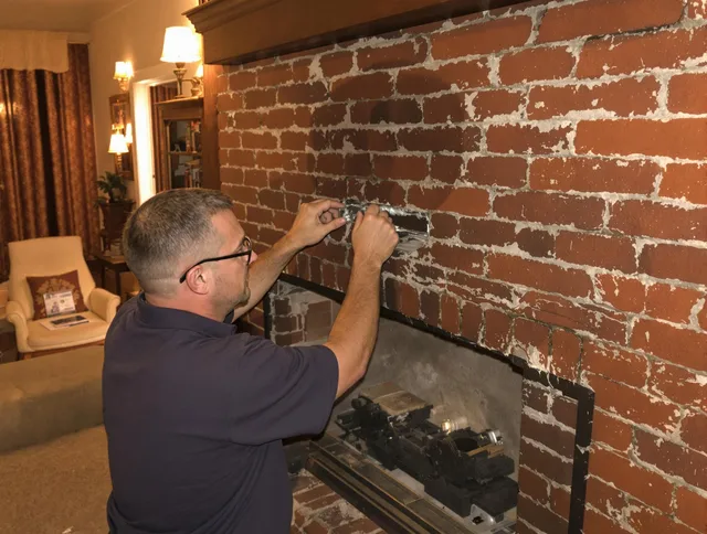 Garden Grove Chimney Sweep expert fixing a fireplace in Garden Grove, CA